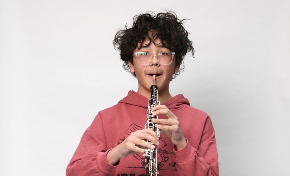 Child playing a clarinet